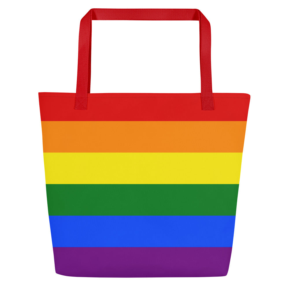 A brightly colored Pride Bag by Pridelity, featuring horizontal rainbow stripes and vibrant red handles, is perfect for your next trip to the rainbow store.