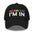 Introducing the "Sounds Gay I'm In Cap" by Pridelity, a black baseball cap ideal for pride outfits. It showcases the vibrant phrase "Sounds Gay" in contrast to the striking white "I'm In," making it a standout accessory for any celebration.