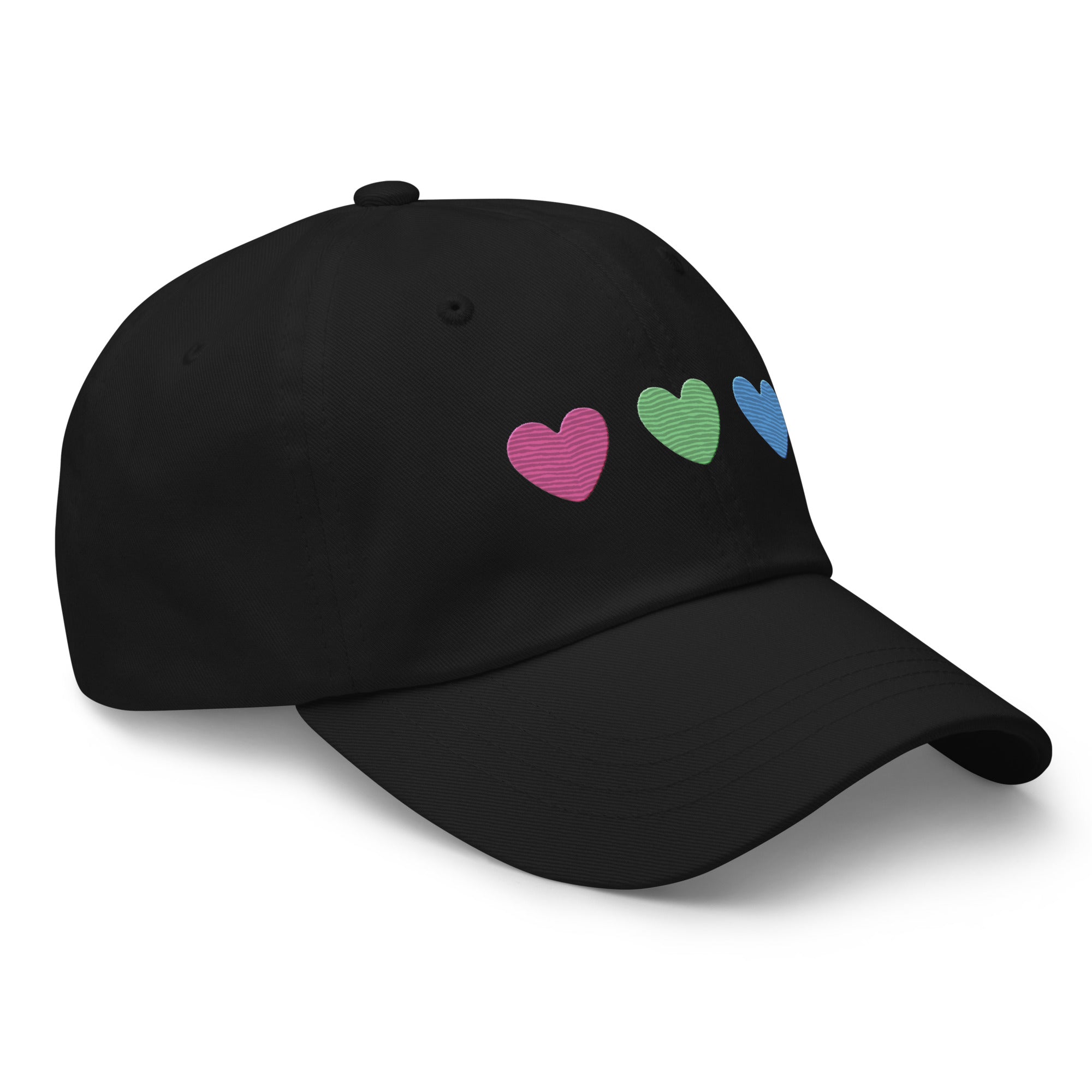 The Polysexual Hearts Cap by Pridelity is a black baseball cap ideal for pride outfits, featuring three embroidered hearts in pink, green, and blue arranged in a row on the front.