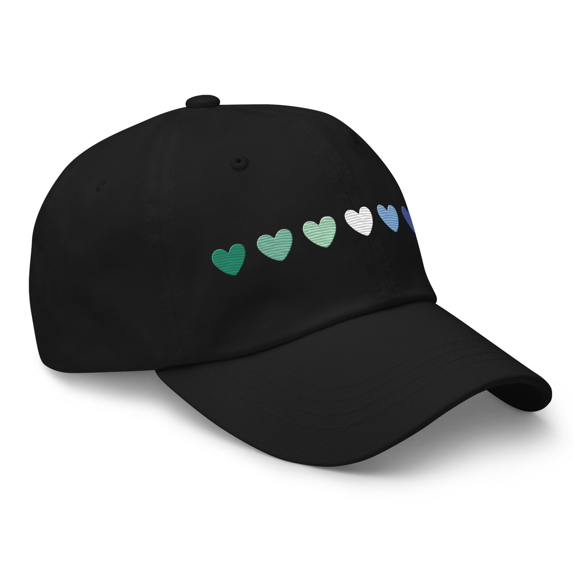 The Gay Men Hearts Cap by Pridelity is a black cap adorned with a row of seven hearts in gradient colors from green to blue, making it an ideal accessory for adding a subtle yet vibrant touch to pride outfits.