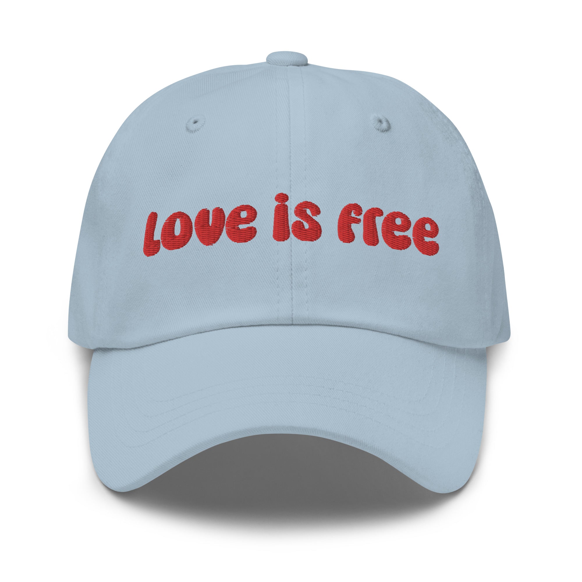 The Pridelity Love Is Free Cap, in a striking white color, is an ideal addition to pride outfits. It boasts the phrase 