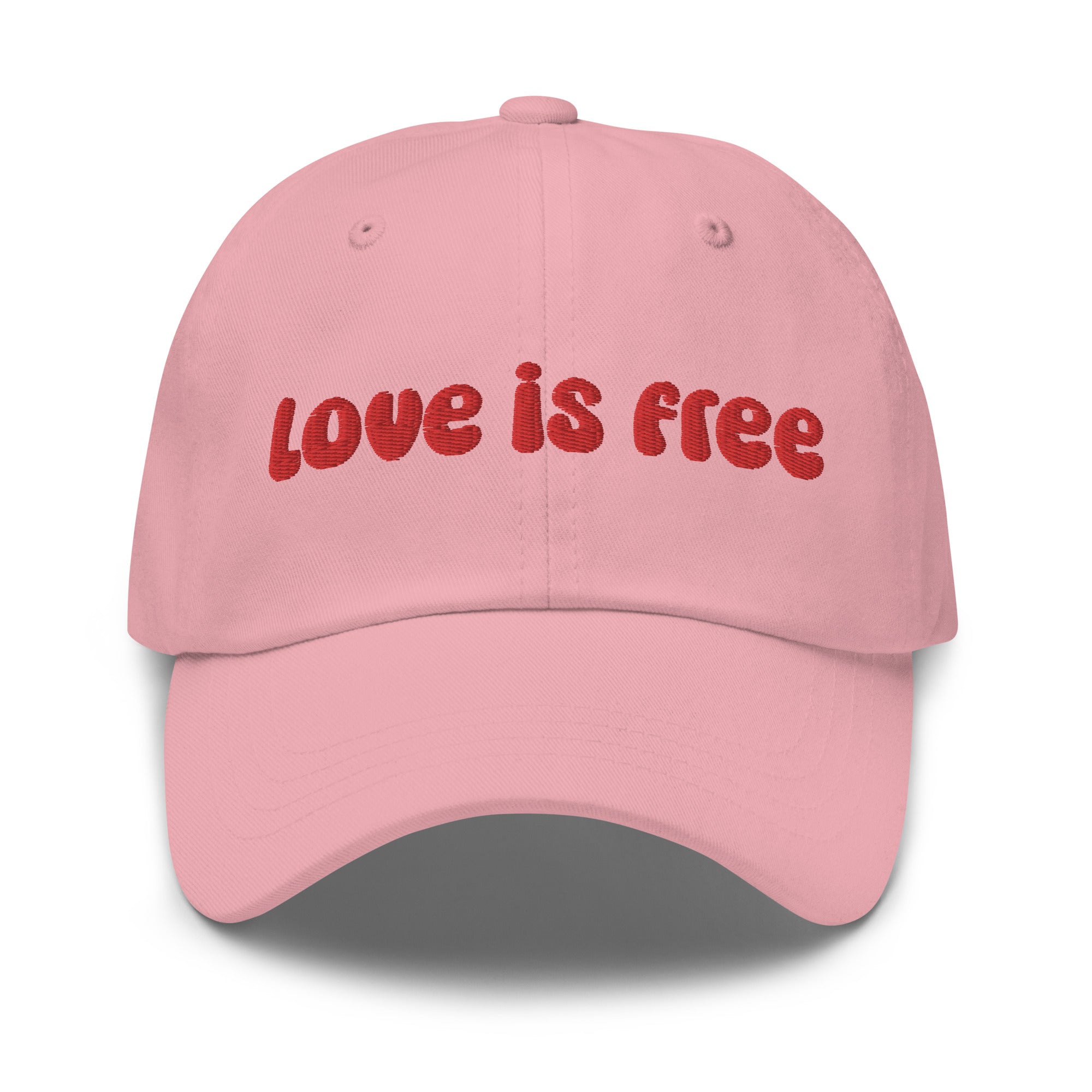 The Pridelity Love Is Free Cap, in a striking white color, is an ideal addition to pride outfits. It boasts the phrase 