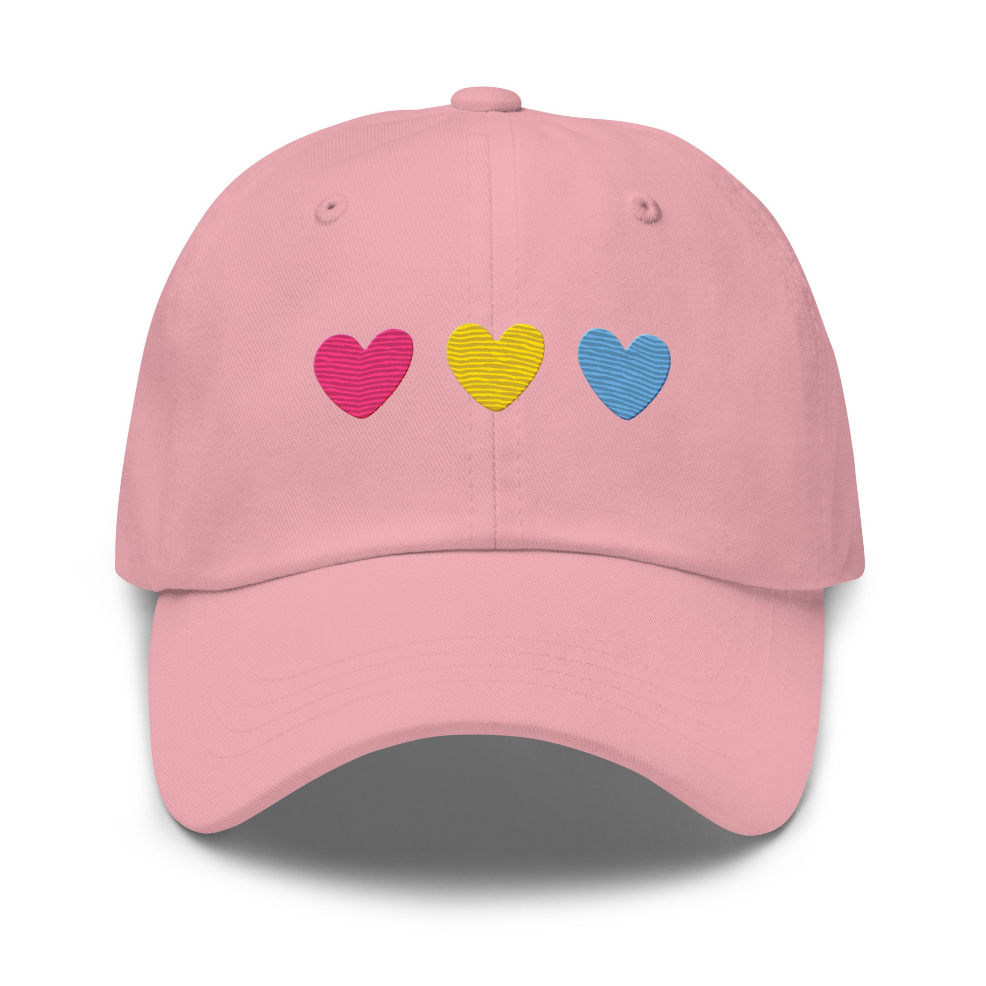 The Pan Hearts Cap by Pridelity, in a light blue hue, brings a playful touch to pride outfits with its three vibrantly embroidered hearts in pink, yellow, and blue.