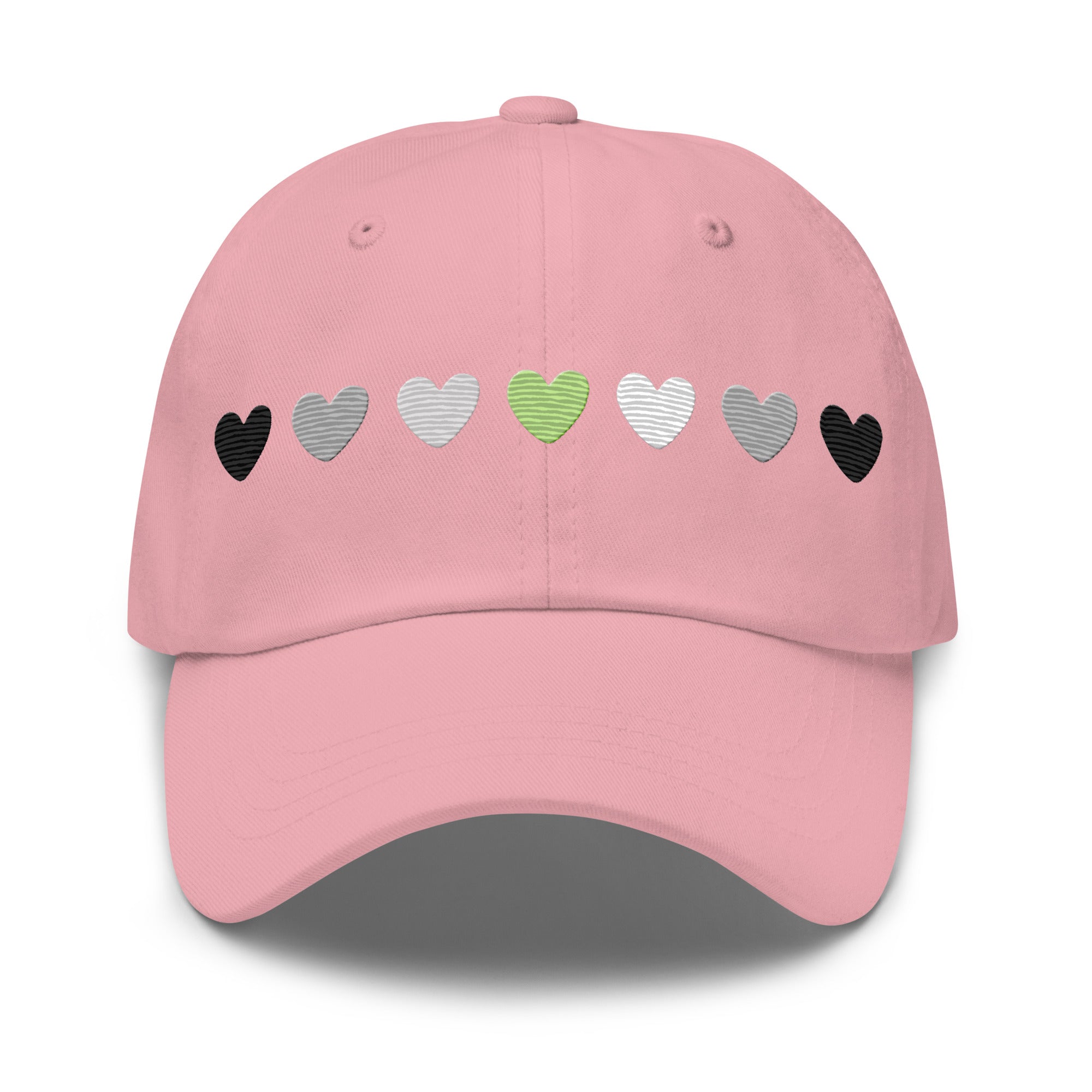 Introducing the Agender Hearts Cap by Pridelity: a pink baseball cap made from Chino cotton twill, showcasing a row of seven heart shapes in the aromantic flag colors—dark green, light green, white, gray, and black. It’s a classic hat featuring a vintage buckle for adjustable comfort.