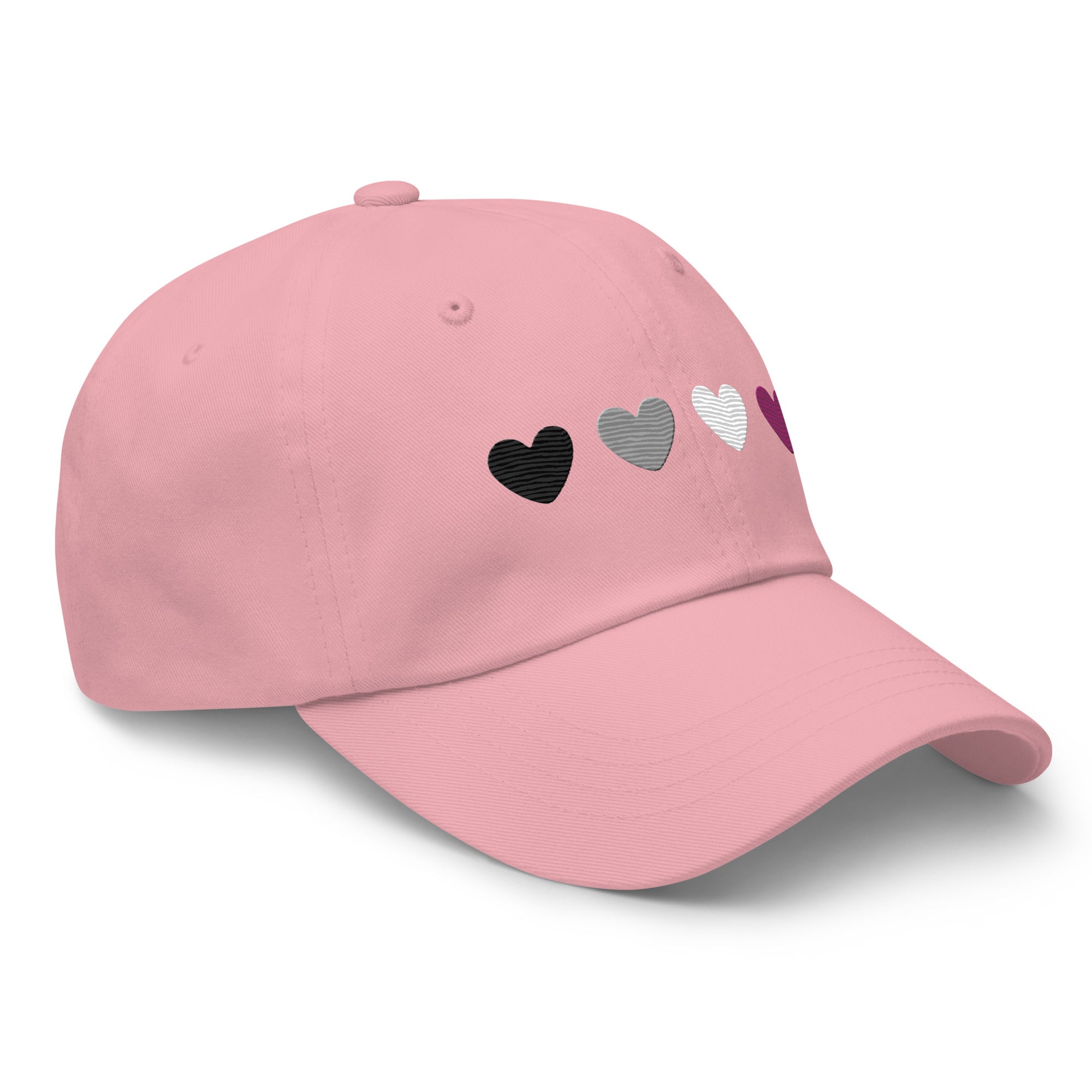 Introducing the Asexual Hearts Cap from Pridelity's Pride Collections, this pink baseball cap proudly displays four hearts in black, gray, white, and purple to represent the asexual flag.