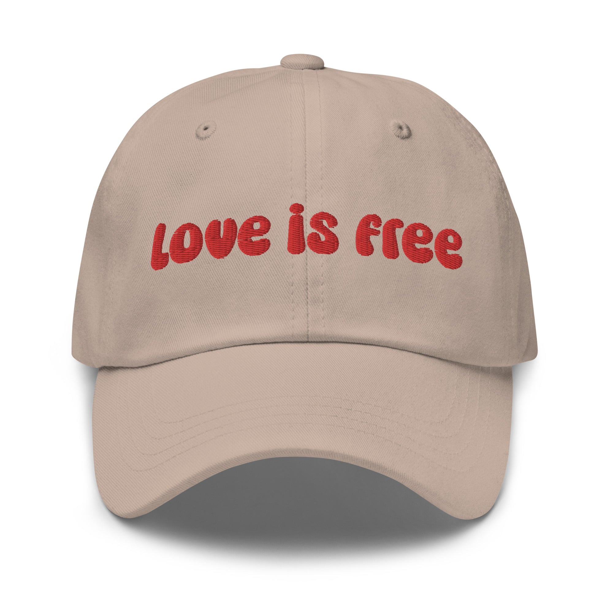 The Pridelity Love Is Free Cap, in a striking white color, is an ideal addition to pride outfits. It boasts the phrase 