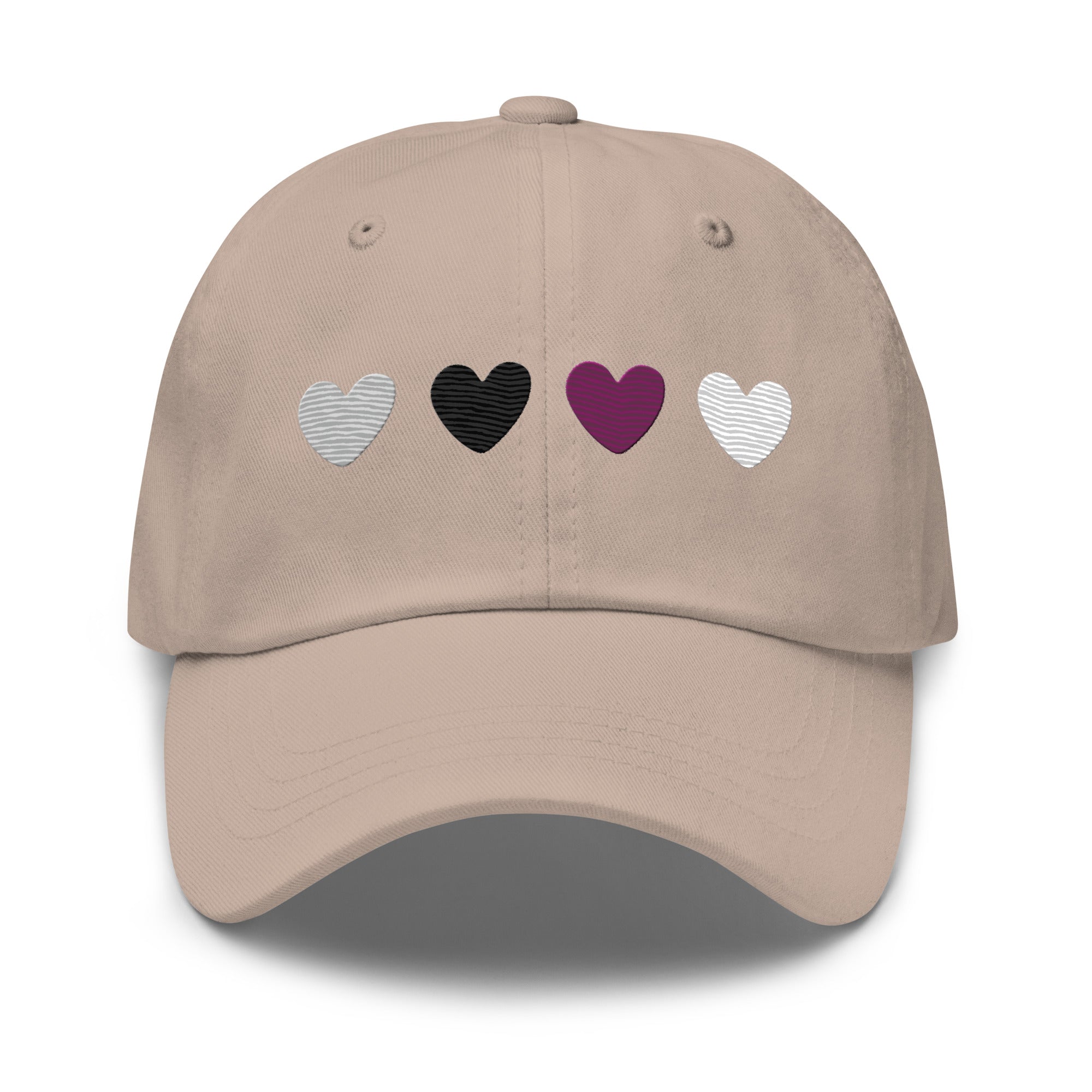 The Demisexual Hearts Cap from Pridelity, featuring four heart symbols in silver, black, purple, and white on a stone base, seamlessly complements pride outfits.