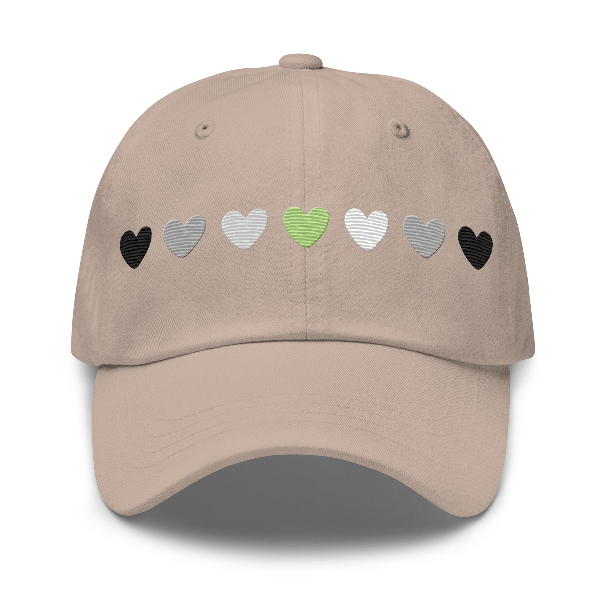 Introducing the Agender Hearts Cap by Pridelity: a pink baseball cap made from Chino cotton twill, showcasing a row of seven heart shapes in the aromantic flag colors—dark green, light green, white, gray, and black. It’s a classic hat featuring a vintage buckle for adjustable comfort.