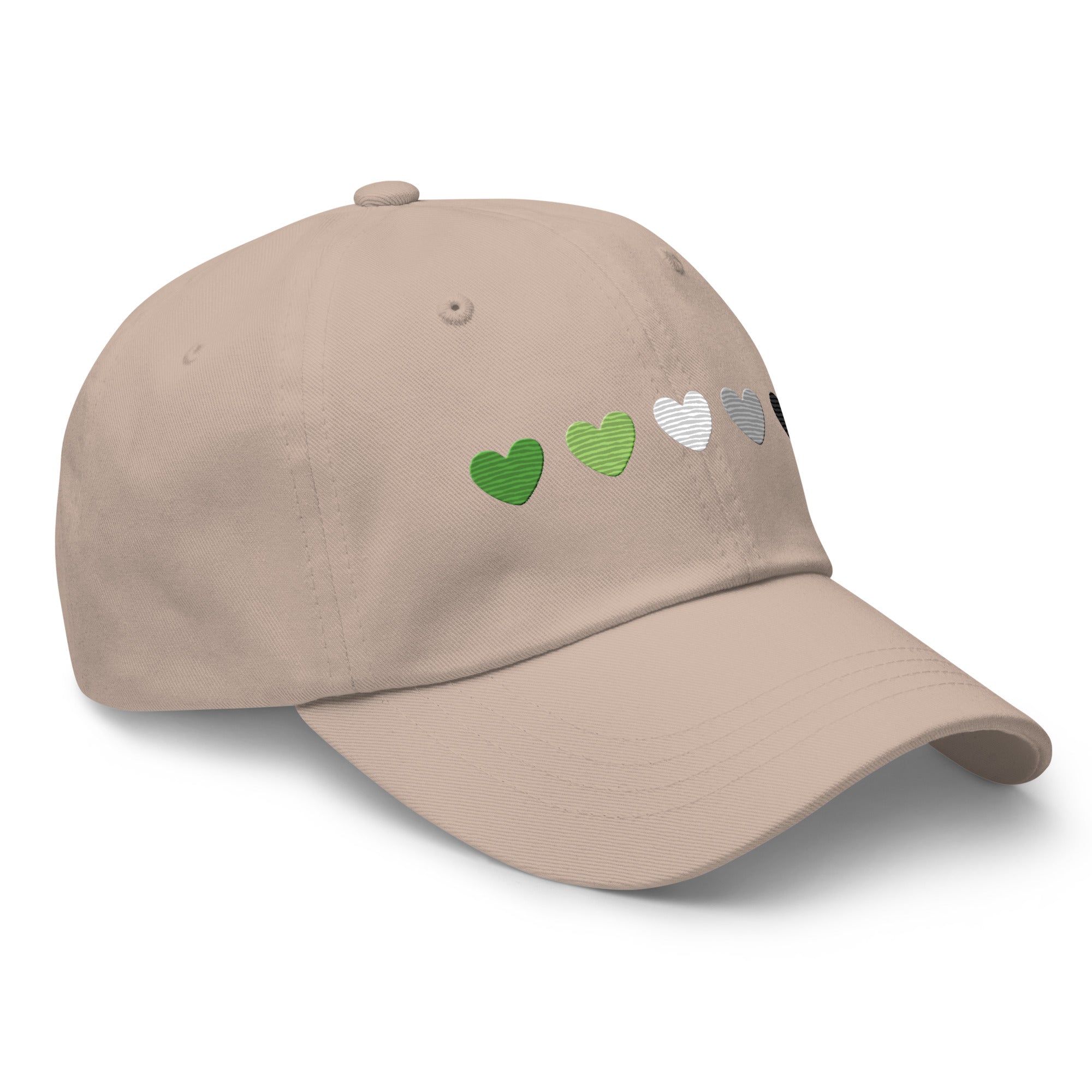 The Aromantic Hearts Cap by Pridelity, part of the Pride Collection, is a beige baseball cap featuring five hearts in a row colored dark green, light green, white, gray, and black to represent the aromantic pride flag.