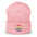 The Pridelity Peace Beanie, in black, showcases a vibrant rainbow-colored peace symbol on the front, making it the perfect accessory to add a touch of pride to any outfit. It is elegantly displayed against a plain white background.