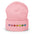 The Pixel Hearts Beanie by Pridelity, in heather grey, celebrates gay pride with a horizontal row of seven stitched pixelated retro gaming-style hearts in the rainbow colors: red, orange, yellow, green, light blue, dark blue, and purple.