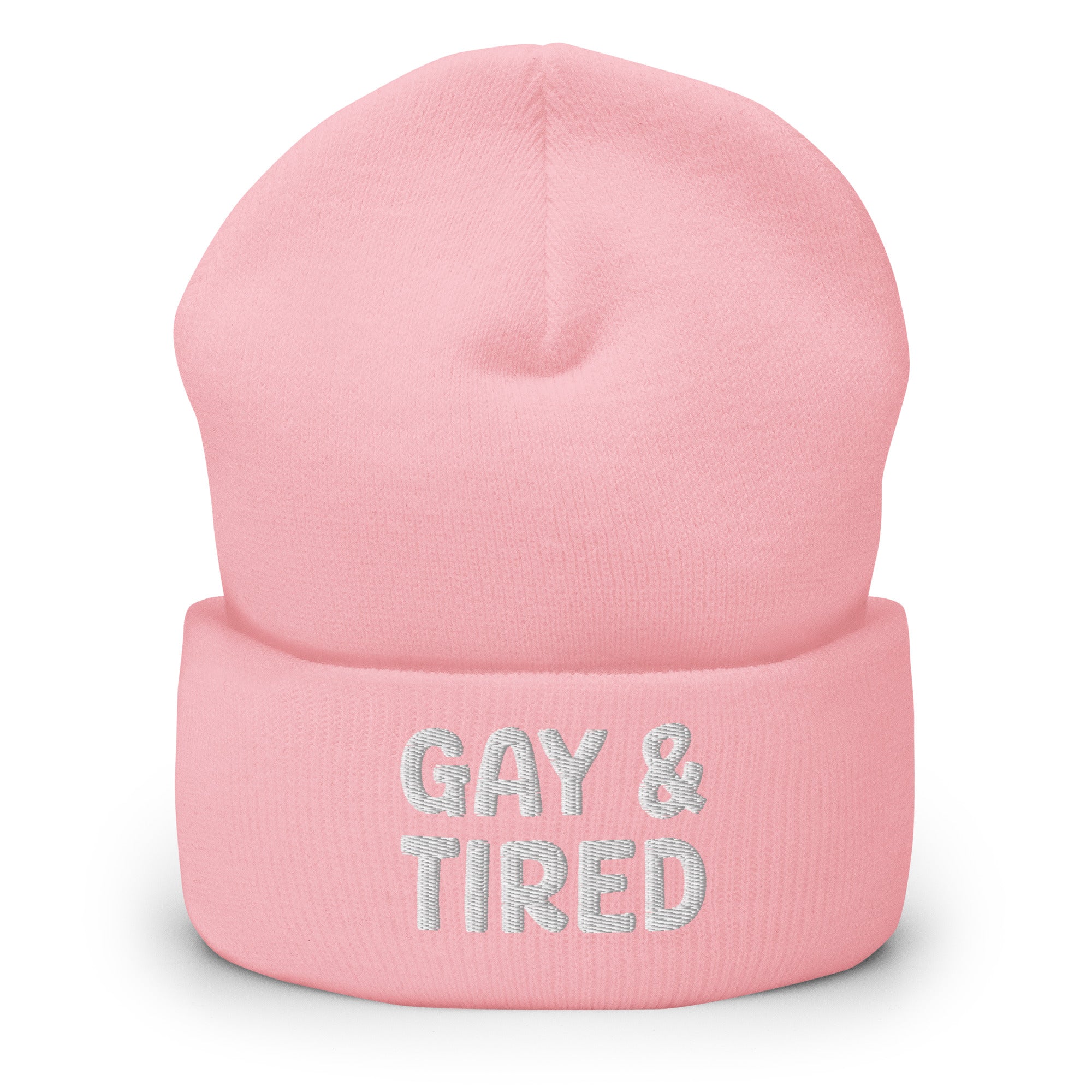 The Gay & Tired Beanie by Pridelity is a stylish accessory for showcasing your individuality, featuring white embroidered text on a black background that boldly states 