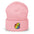 The Pride Duck Beanie by Pridelity, a striking piece of gay clothing, showcases an embroidered rubber duck with a rainbow pattern on its body, located on the cuff. This gold beanie features a folded brim and a rounded top.