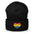 A black Heart Beanie by Pridelity, adorned with a rainbow-striped heart emblem representing the spirit of gay clothing, is showcased against a plain white background. The vibrant heart signifies diversity and inclusion.