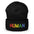 Discover the Human Beanie by Pridelity, a stylish white accessory featuring "HUMAN" embroidered in vibrant rainbow colors, capturing the spirit of gay clothing.