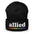 Introducing the Allied Beanie from Pridelity: This striking black beanie features the word "allied" embroidered in white, with a small rainbow-colored line below to celebrate Pride. It's crafted from textured fabric and has a folded bottom, making it an essential standout in any Pride Merch collection.