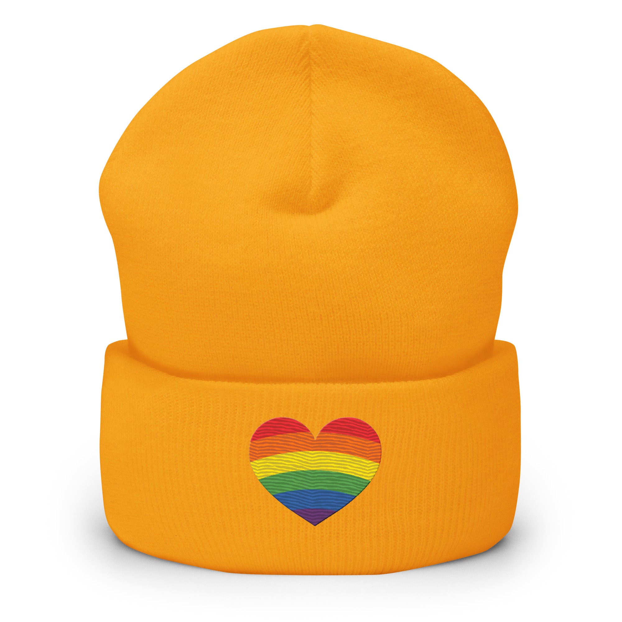 A black Heart Beanie by Pridelity, adorned with a rainbow-striped heart emblem representing the spirit of gay clothing, is showcased against a plain white background. The vibrant heart signifies diversity and inclusion.