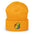 The Pride Duck Beanie by Pridelity, a striking piece of gay clothing, showcases an embroidered rubber duck with a rainbow pattern on its body, located on the cuff. This gold beanie features a folded brim and a rounded top.