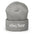 The She/Her Beanie by Pridelity, ideal for those seeking gay clothing options, is a heather grey knit beanie with the pronouns "she/her" beautifully embroidered in white on the front.