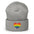 A black Heart Beanie by Pridelity, adorned with a rainbow-striped heart emblem representing the spirit of gay clothing, is showcased against a plain white background. The vibrant heart signifies diversity and inclusion.