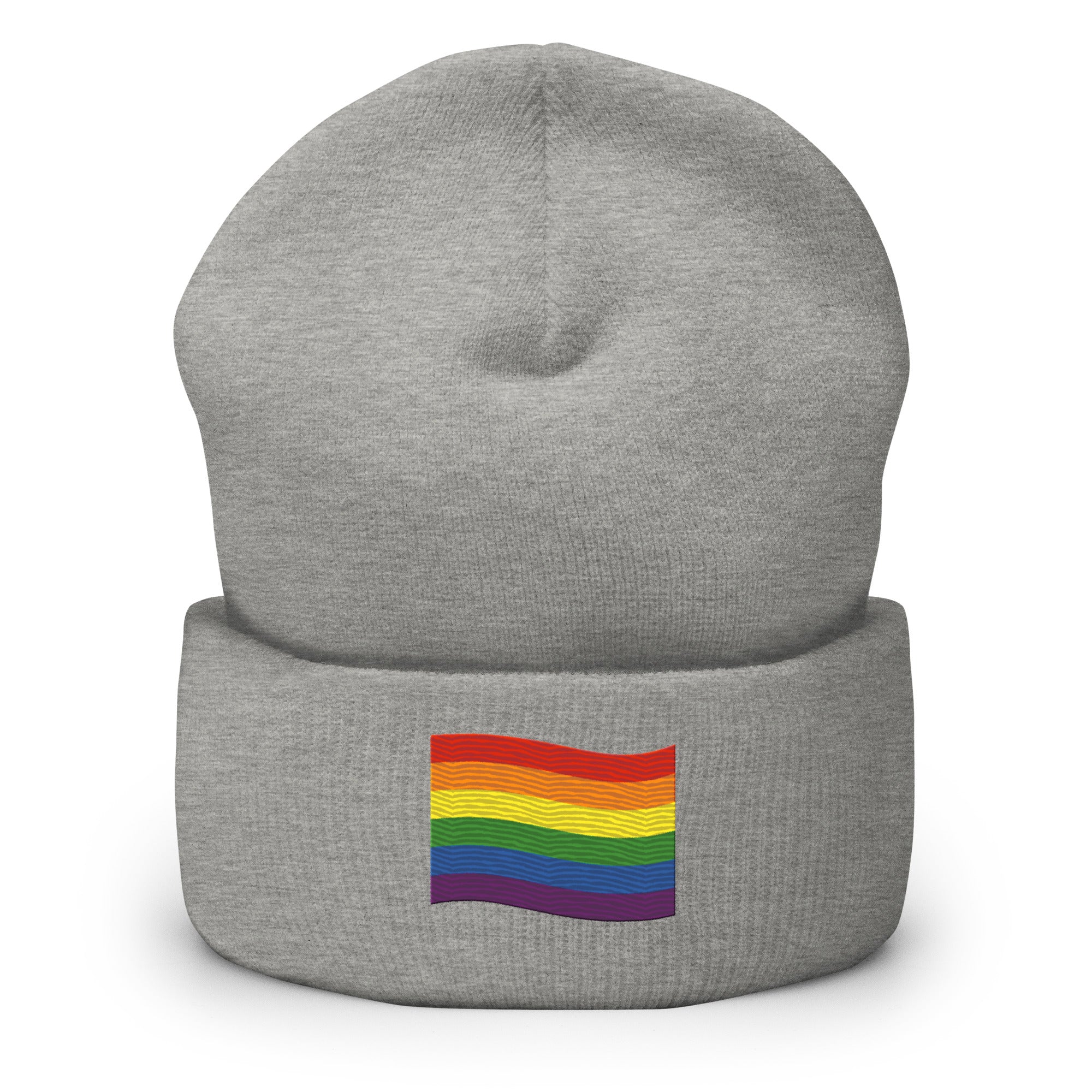 The Pride Flag Beanie by Pridelity is a white beanie adorned with an embroidered colorful rainbow flag on its folded brim, ideal for anyone looking for gay clothing that celebrates identity. The vibrant flag showcases red, orange, yellow, green, blue, and purple stripes representing LGBTQ+ pride.