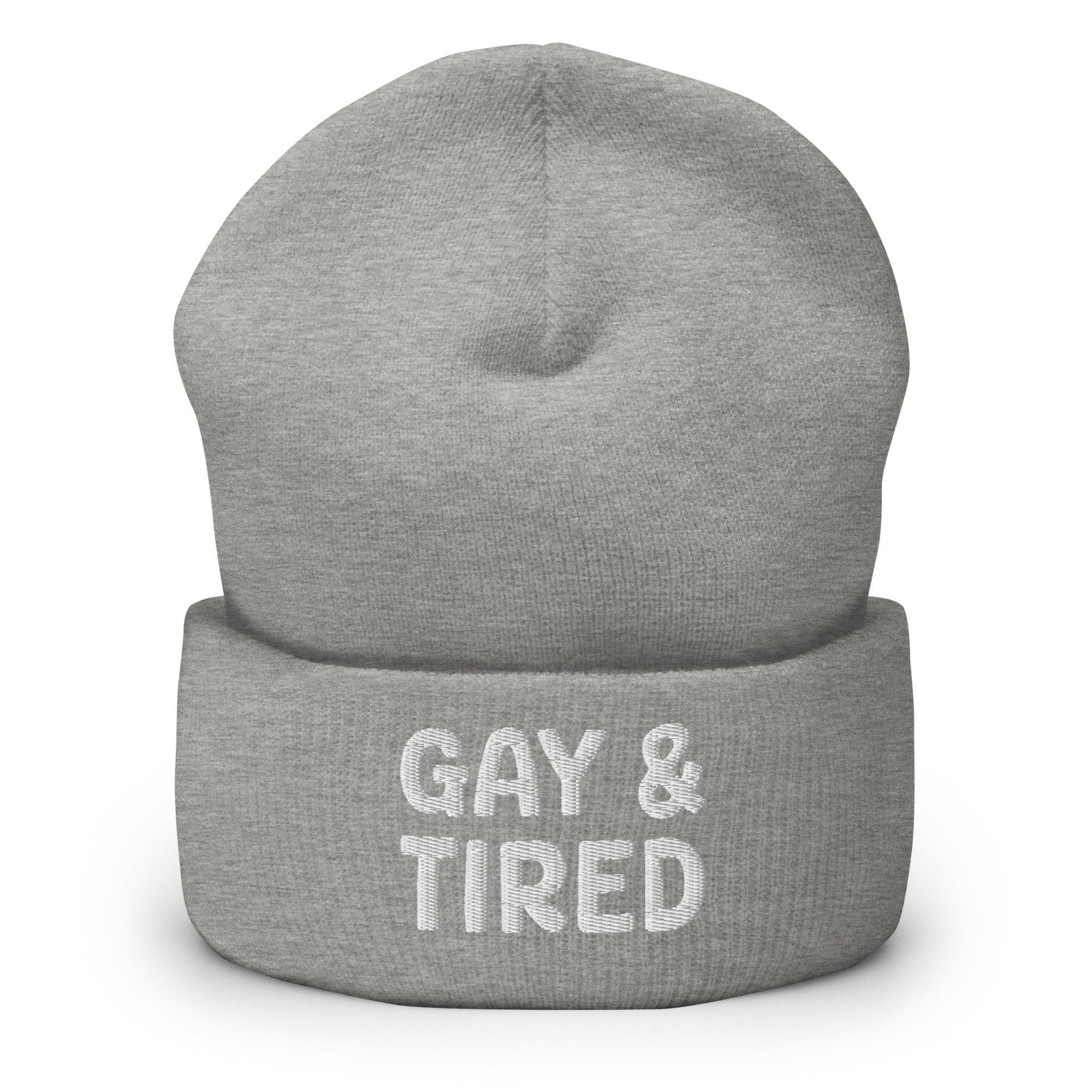 The Gay & Tired Beanie by Pridelity is a stylish accessory for showcasing your individuality, featuring white embroidered text on a black background that boldly states 