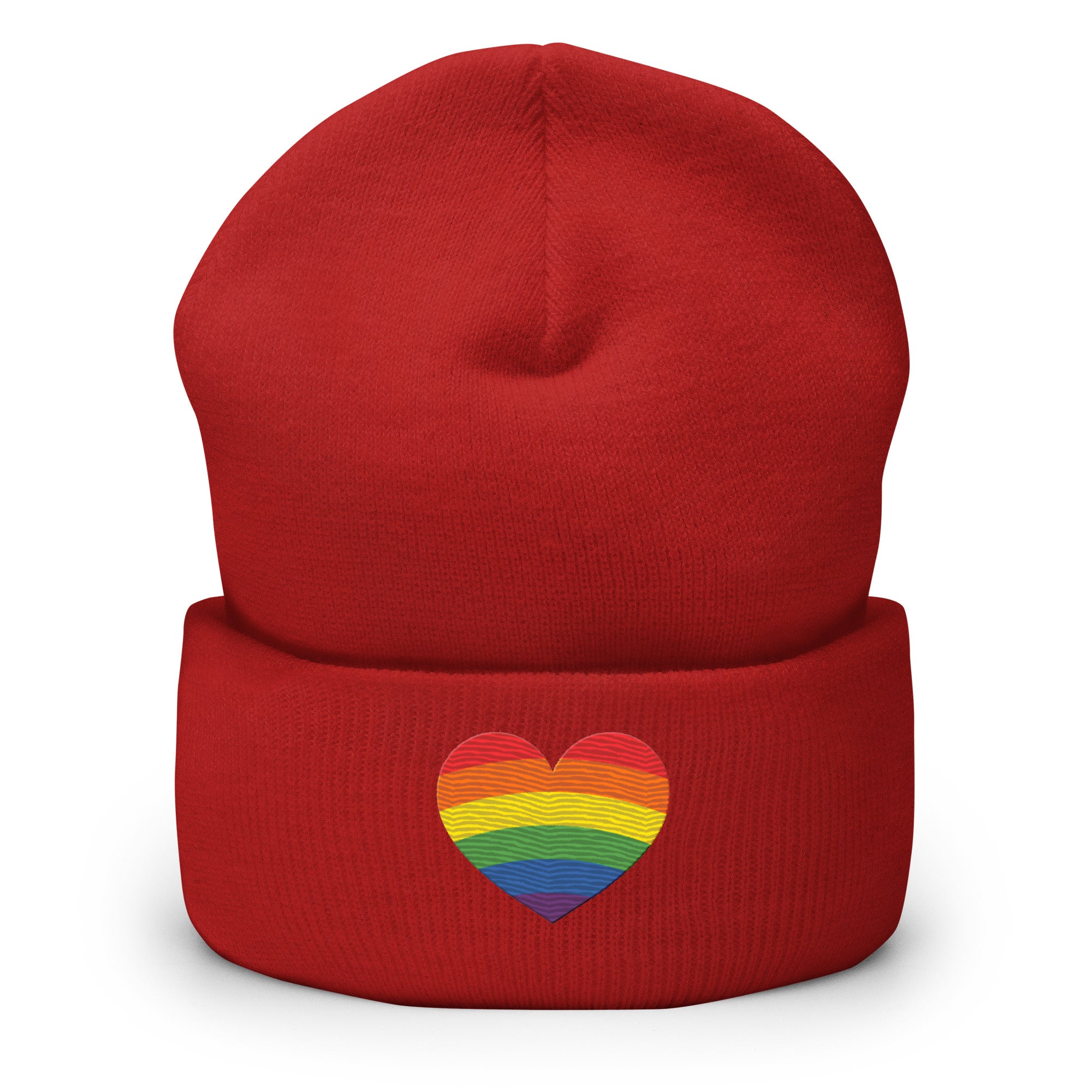 A black Heart Beanie by Pridelity, adorned with a rainbow-striped heart emblem representing the spirit of gay clothing, is showcased against a plain white background. The vibrant heart signifies diversity and inclusion.