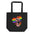 The black "Fist Up Tote Bag" from Pridelity features a raised fist against a rainbow-colored heart, symbolizing solidarity and support for LGBTQ+ rights.