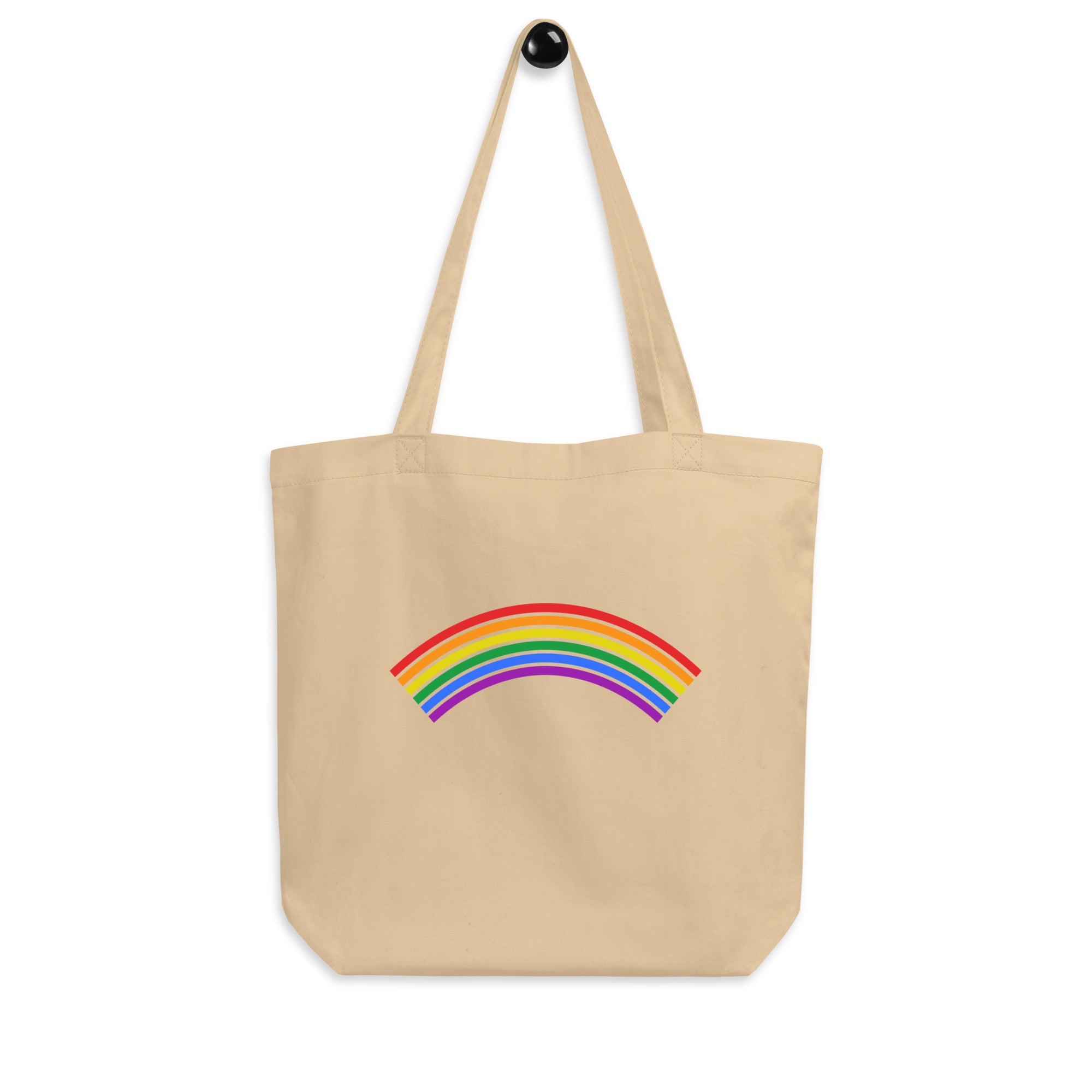 Explore the Rainbow Tote Bag by Pridelity, a vibrant black accessory featuring a striking rainbow design at its center. The rainbow is highlighted with six vivid stripes—red, orange, yellow, green, blue, and purple. Complete with sturdy long handles, it's perfect for all your daily adventures.