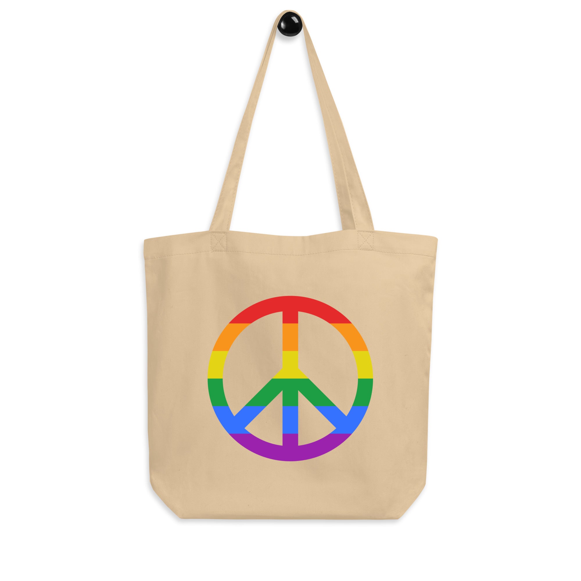 Introducing the Peace Tote Bag by Pridelity, a sleek black tote adorned with a captivating rainbow-colored peace sign at its center and vibrant horizontal stripes. Featuring two comfortable shoulder straps, it's perfect for everyday use and available exclusively at Rainbow Store.