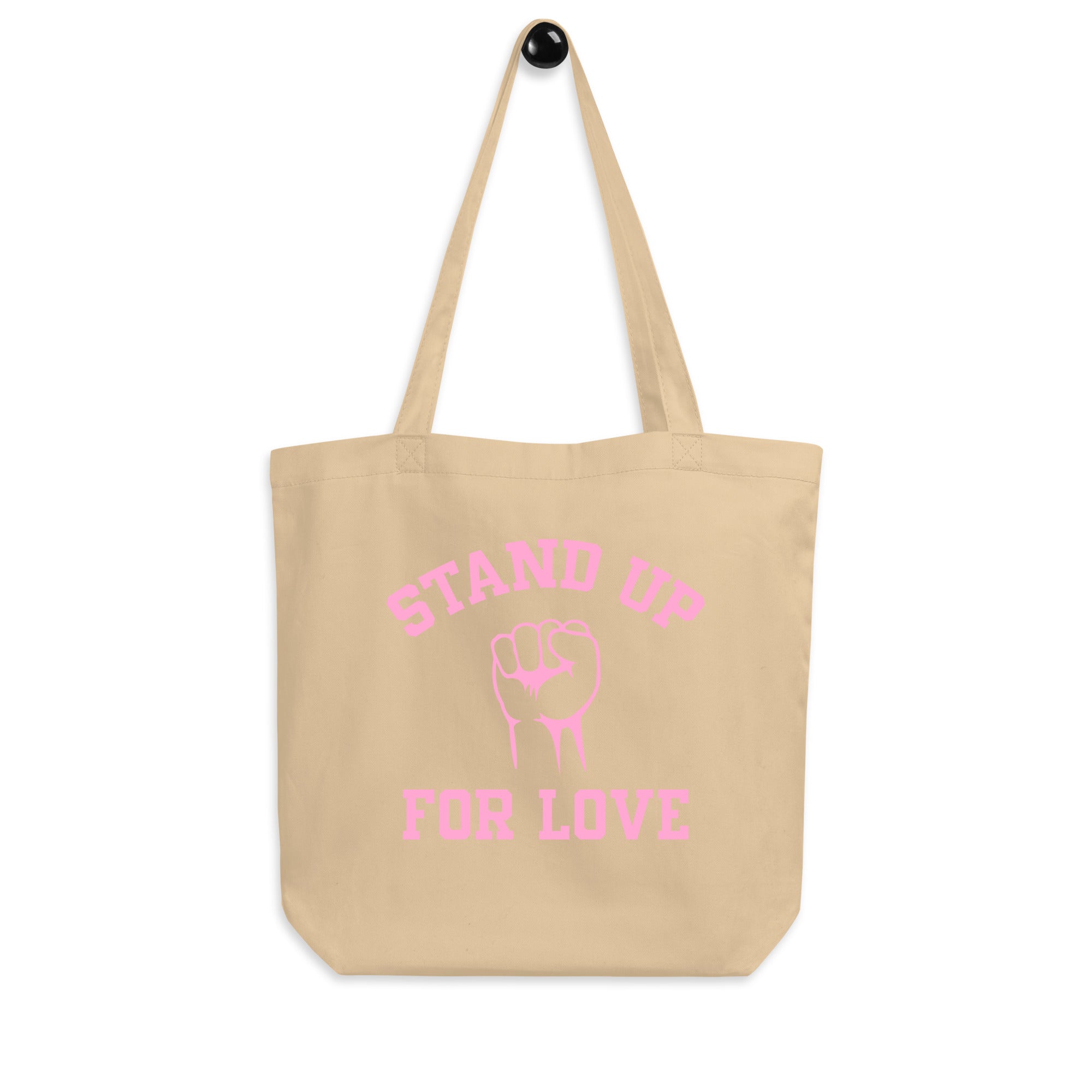 The Stand Up Tote Bag from Pridelity is a black tote adorned with pink text that reads 