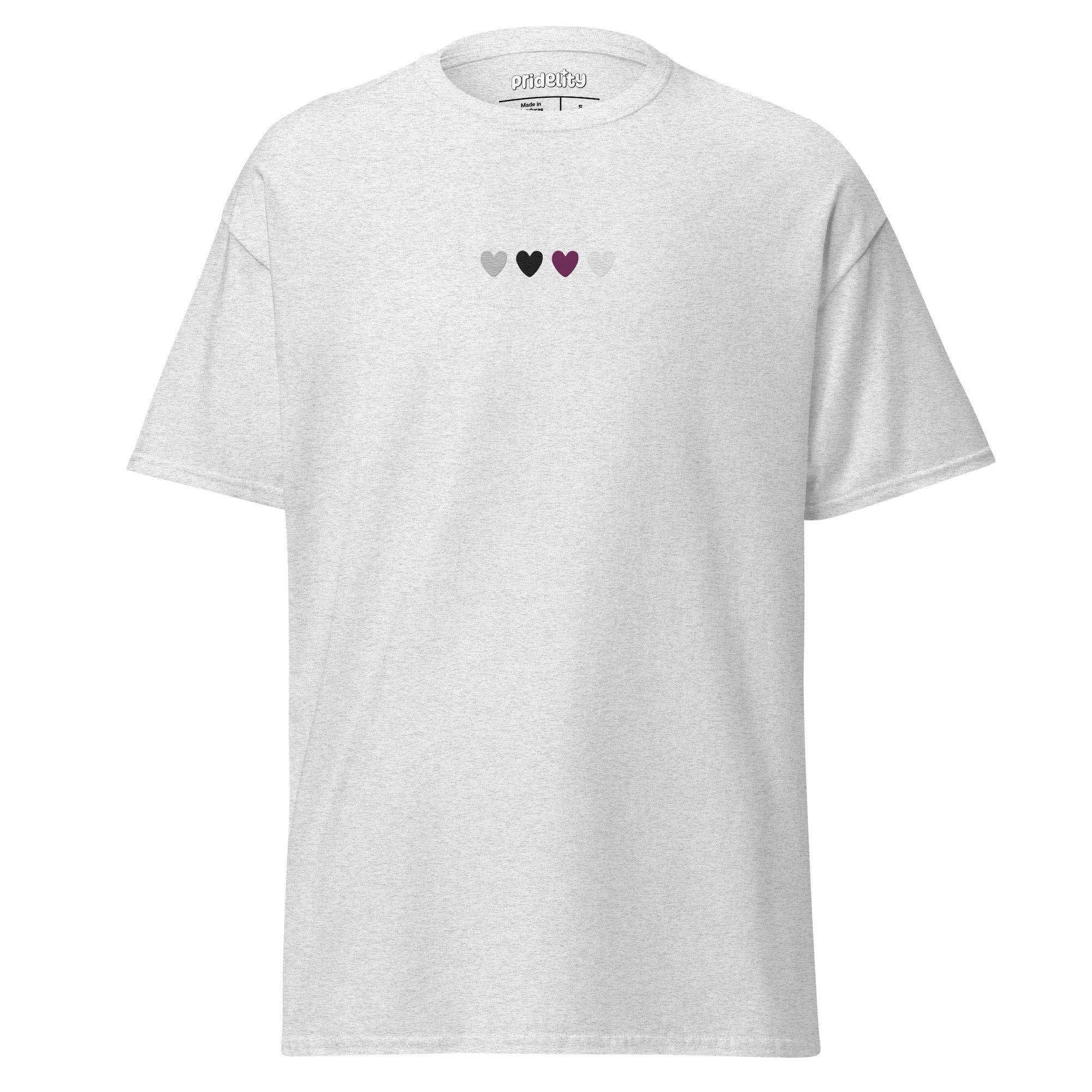 The Demisexual Love T-Shirt from Pridelity is a pink t-shirt adorned with four vibrant hearts in a row on the chest, each heart symbolizing diversity with shades of green, black, brown, and pink. This pride t-shirt elegantly embodies unity and love within our pride collections.