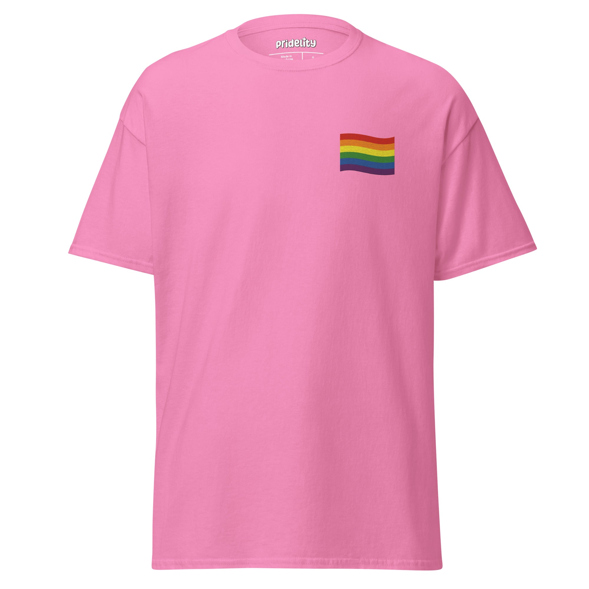 A Pride Flag T-Shirt by Pridelity in white showcases a small rainbow flag graphic on the upper left chest area, where the plain background accentuates the vibrant flag design.