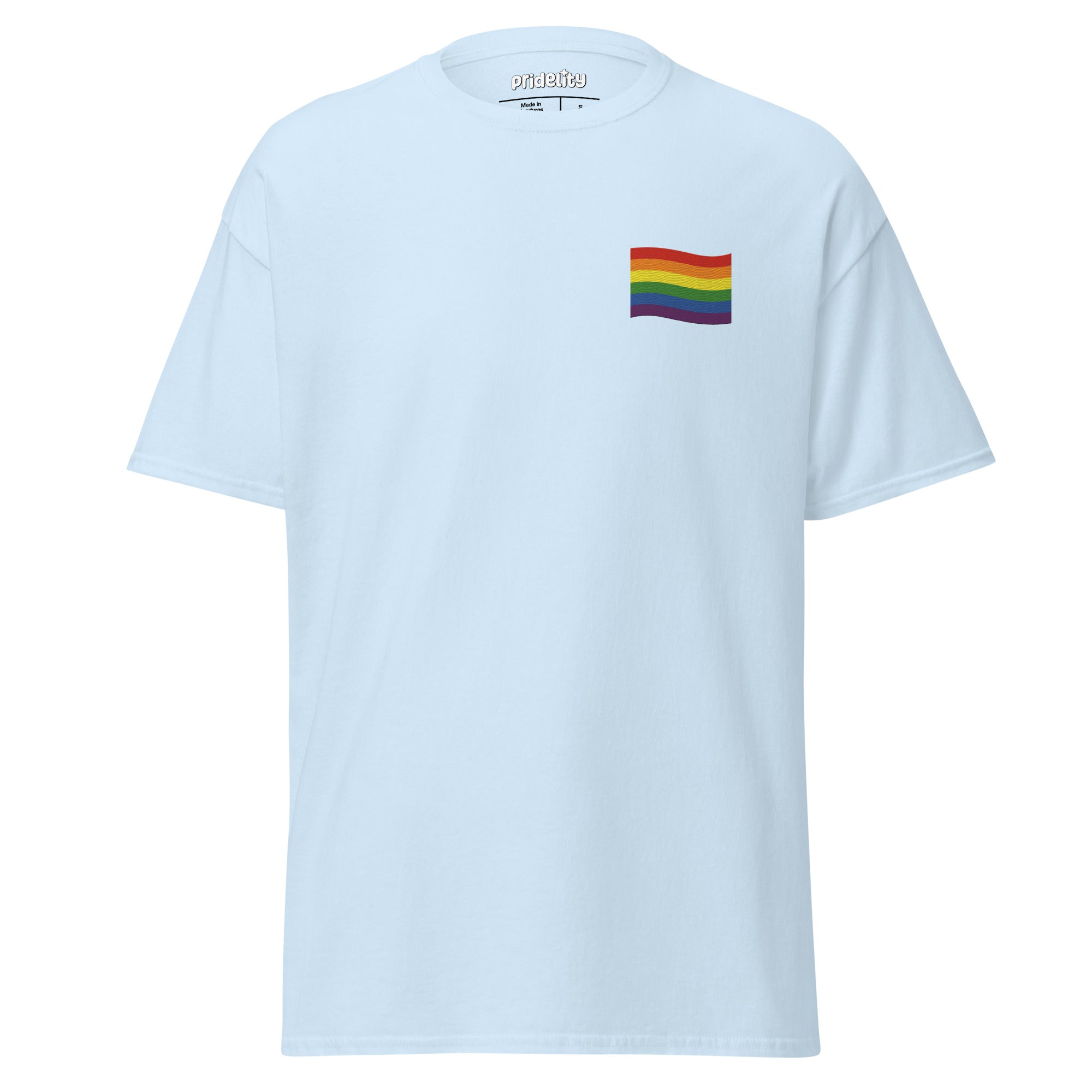 A Pride Flag T-Shirt by Pridelity in white showcases a small rainbow flag graphic on the upper left chest area, where the plain background accentuates the vibrant flag design.