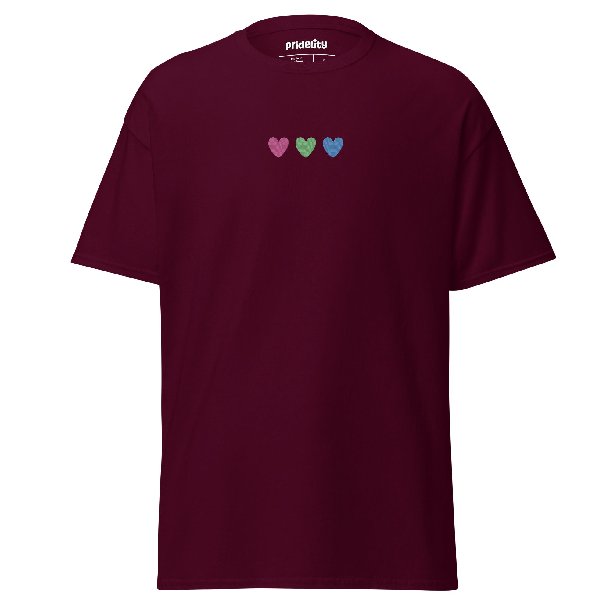 The Pridelity Polysexual Love T-Shirt is a plain white pride shirt adorned with three small heart symbols in pink, green, and blue across the chest.