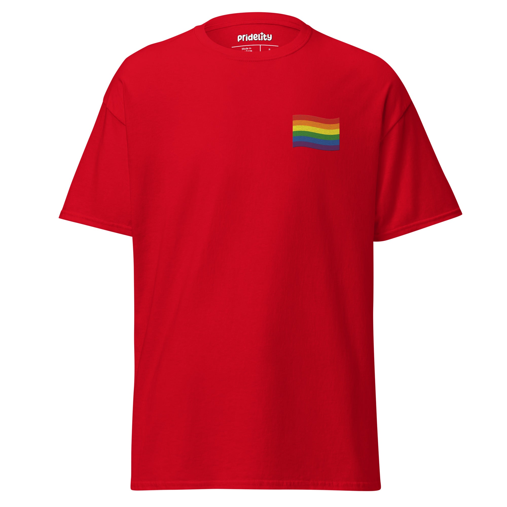 A Pride Flag T-Shirt by Pridelity in white showcases a small rainbow flag graphic on the upper left chest area, where the plain background accentuates the vibrant flag design.