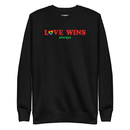 Introducing the "Love Wins, Always Sweatshirt" by Pridelity. This white sweatshirt prominently displays the bold red and green phrase "LOVE WINS always," with a unique twist: the "O" in "LOVE" is crafted into a vibrant rainbow-colored heart. It’s an ideal choice for anyone who embraces love with rainbow-inspired apparel.