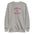 A folded white Pridelity Stand Up Sweatshirt showcases the phrase "STAND UP FOR LOVE" in red, encircling a striking graphic of a raised fist, making it a distinctive addition to any pride collection.