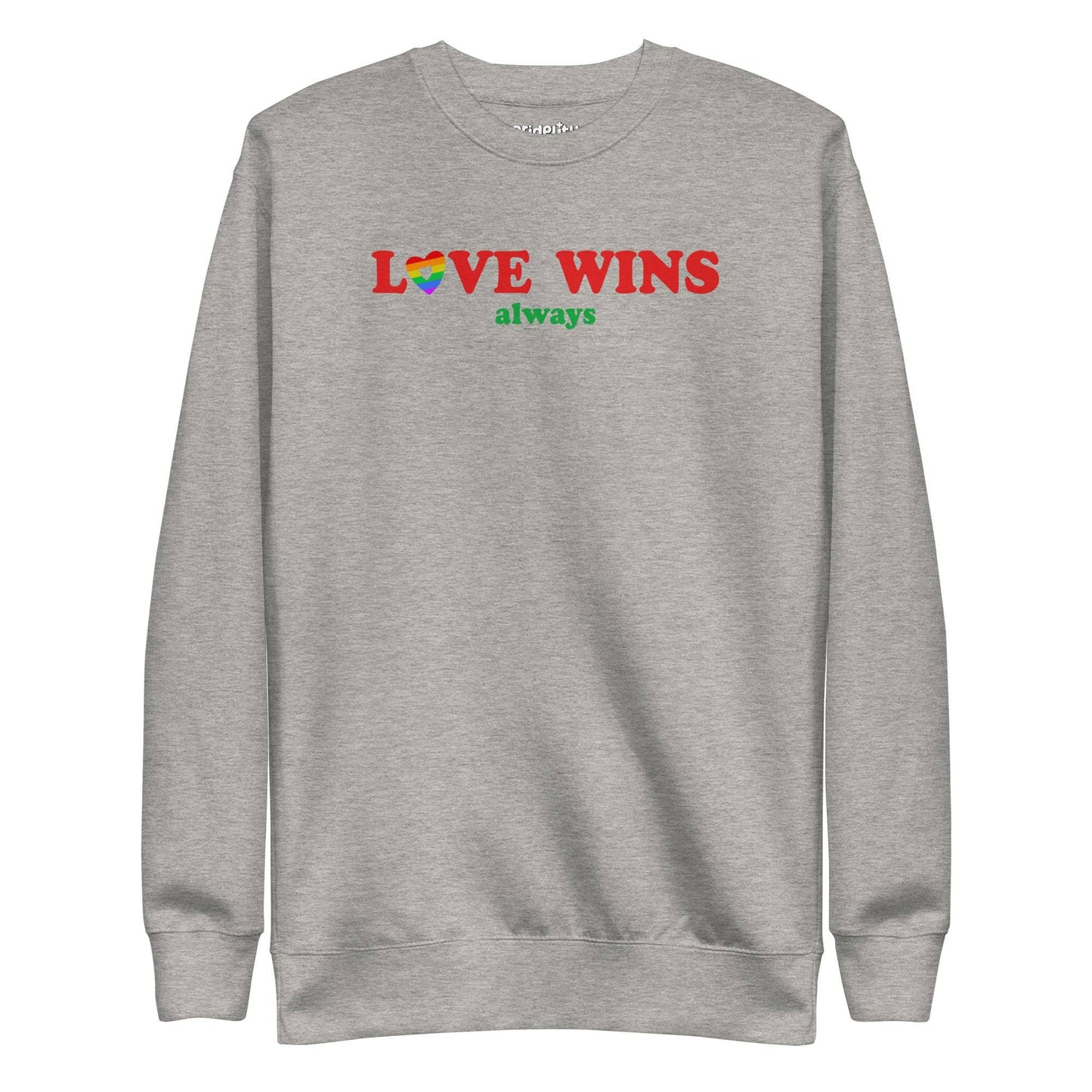 Introducing the "Love Wins, Always Sweatshirt" by Pridelity. This white sweatshirt prominently displays the bold red and green phrase "LOVE WINS always," with a unique twist: the "O" in "LOVE" is crafted into a vibrant rainbow-colored heart. It’s an ideal choice for anyone who embraces love with rainbow-inspired apparel.