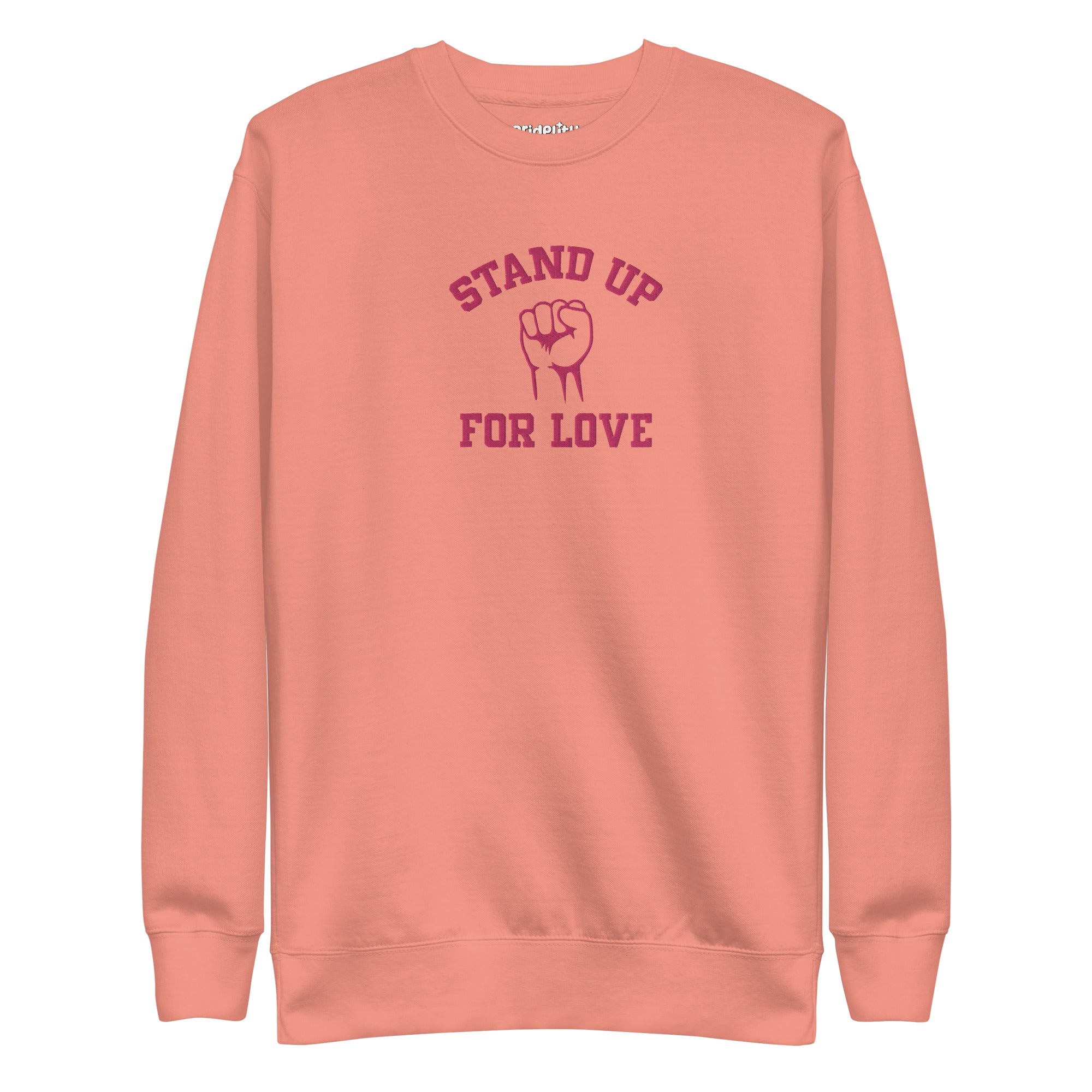 A folded white Pridelity Stand Up Sweatshirt showcases the phrase 