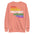 The Pridelity Protest Sweatshirt from the pride collection is a black sweatshirt that showcases "PROTEST" in a vibrant descending stack of colors: red, orange, yellow, white, green, and blue. Each instance of the word is mirrored upside down below it, making for a striking pride outfit.