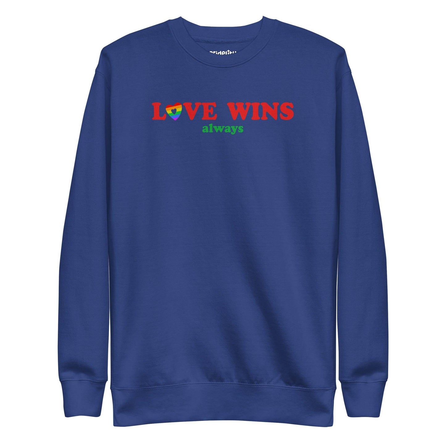 Introducing the "Love Wins, Always Sweatshirt" by Pridelity. This white sweatshirt prominently displays the bold red and green phrase "LOVE WINS always," with a unique twist: the "O" in "LOVE" is crafted into a vibrant rainbow-colored heart. It’s an ideal choice for anyone who embraces love with rainbow-inspired apparel.