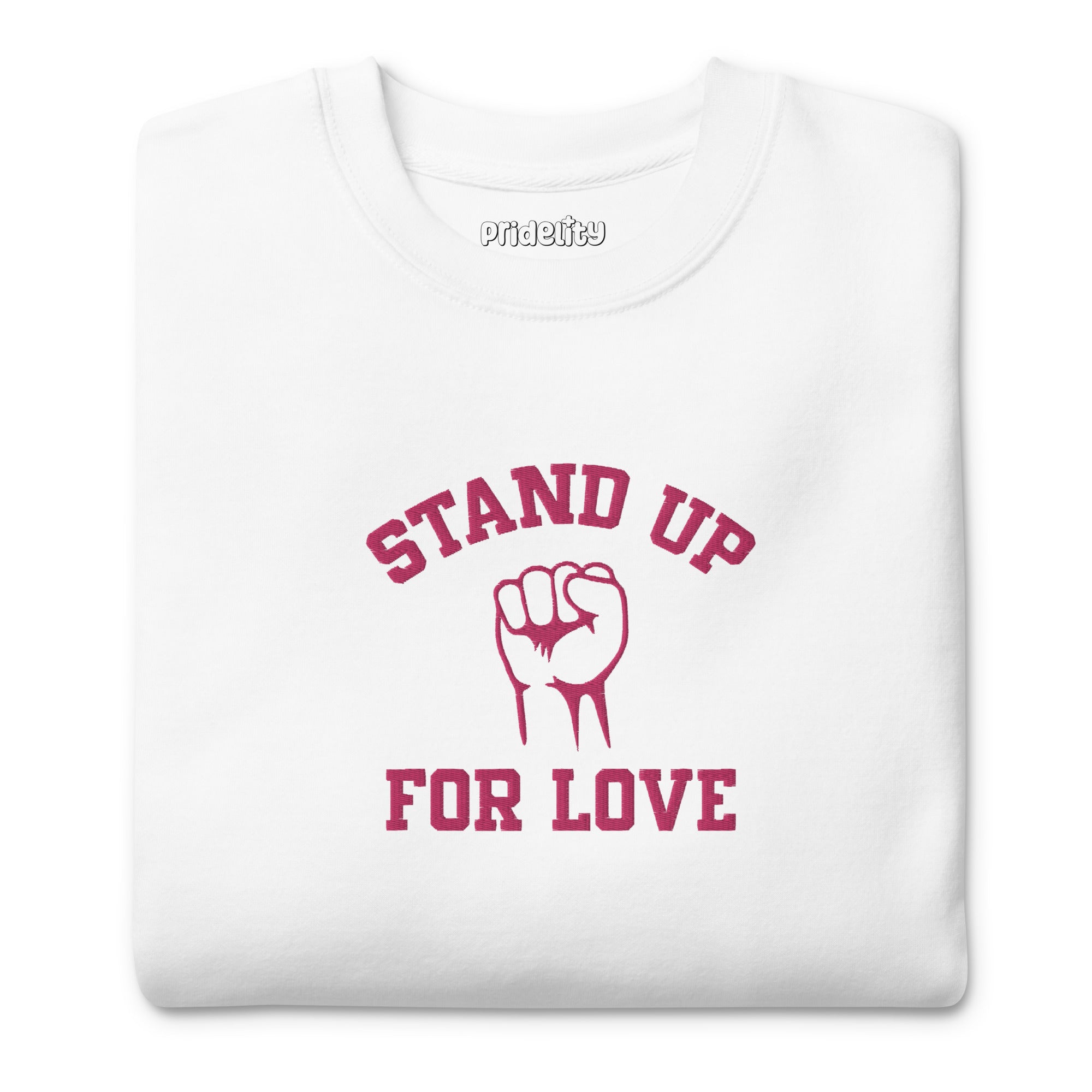 A folded white Pridelity Stand Up Sweatshirt showcases the phrase 