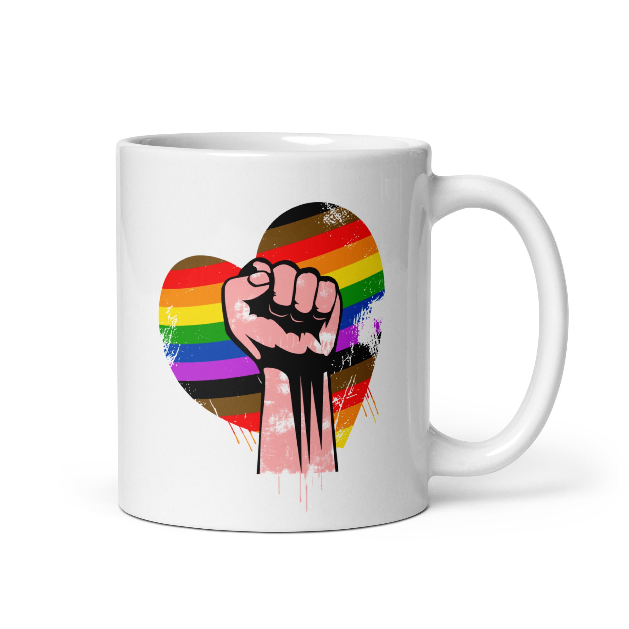 Explore Pridelity's 2025 pride collections with the Fist Mug, a white mug featuring a fist raised in front of a heart decorated with vibrant rainbow and brown colors, symbolizing unity and pride.