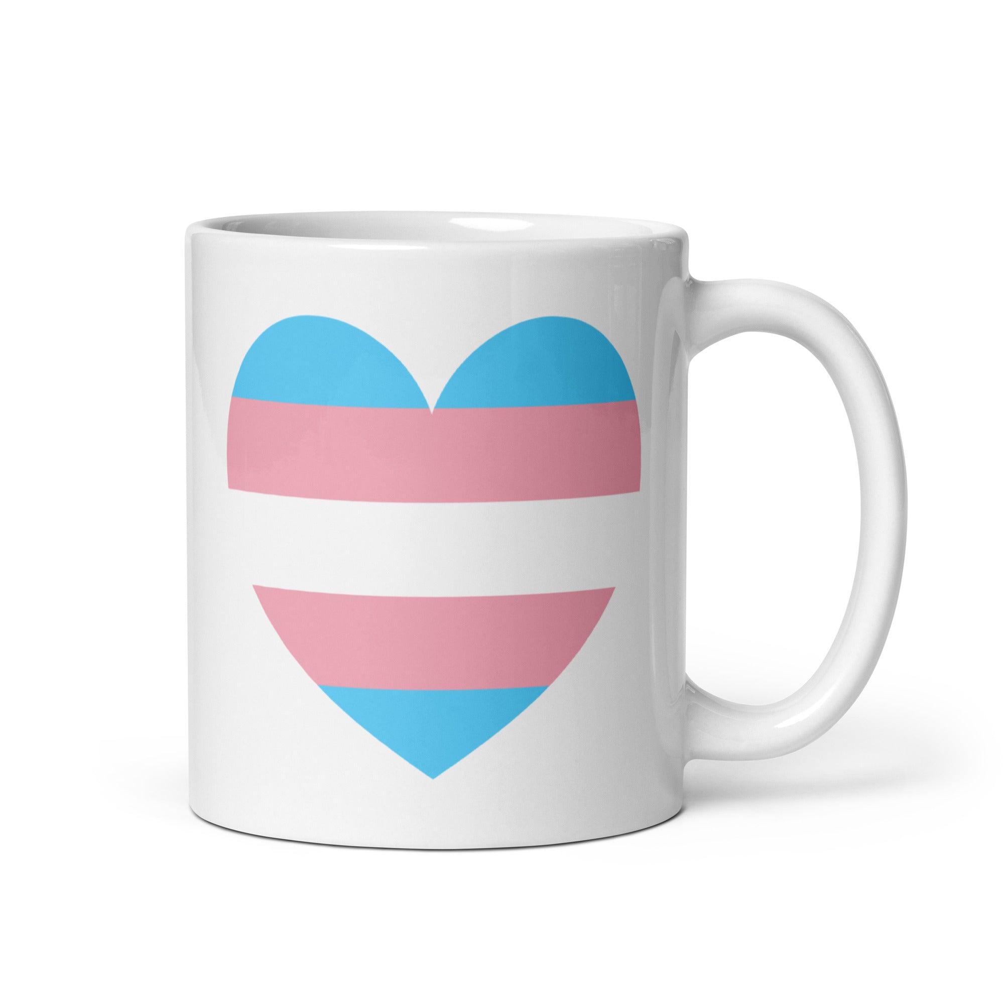 The Trans Heart Mug by Pridelity, part of the Pride Collection 2025, is a white mug featuring a heart design with horizontal stripes in light blue, pink, and white that represent the transgender pride flag.