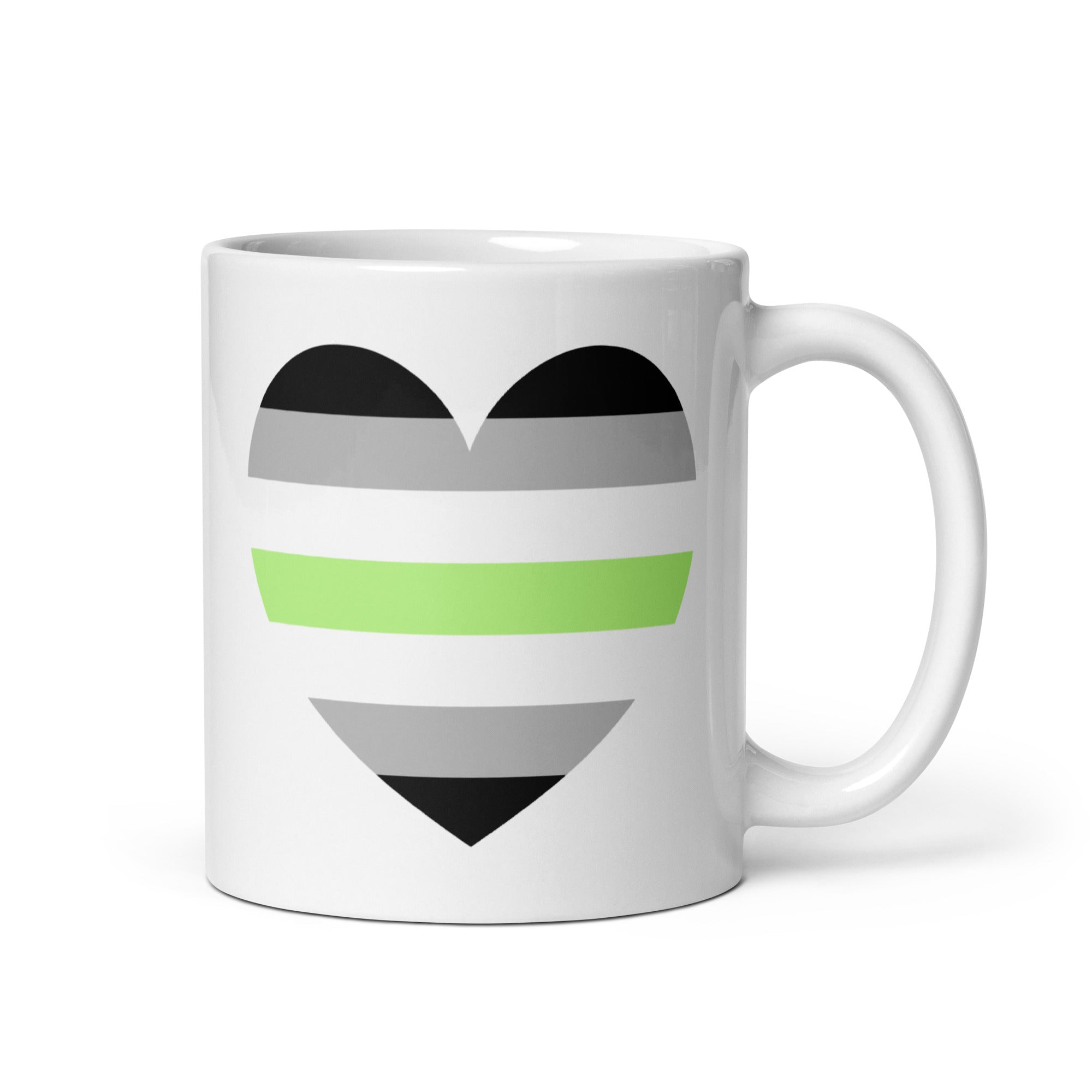 The Agender Heart Mug by Pridelity boasts a charming heart design adorned with black, gray, white, and green stripes that represent the agender pride flag. Safe for use in dishwashers and microwaves, this ceramic mug is available for shipping from Europe and the USA.