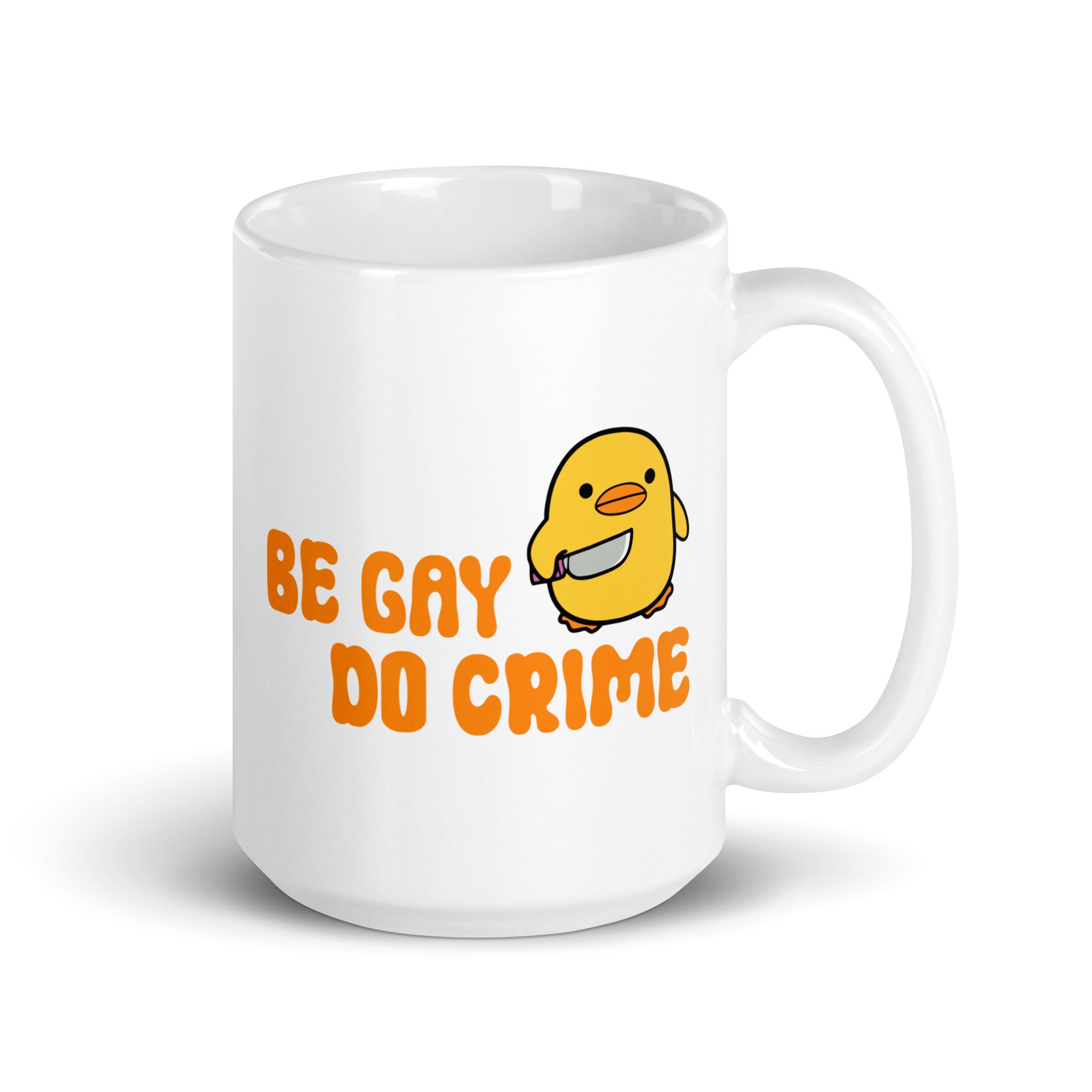 This white mug from Pridelity's Be Gay Do Crime collection showcases a cute yellow duck holding a knife, accompanied by bold orange text reading 