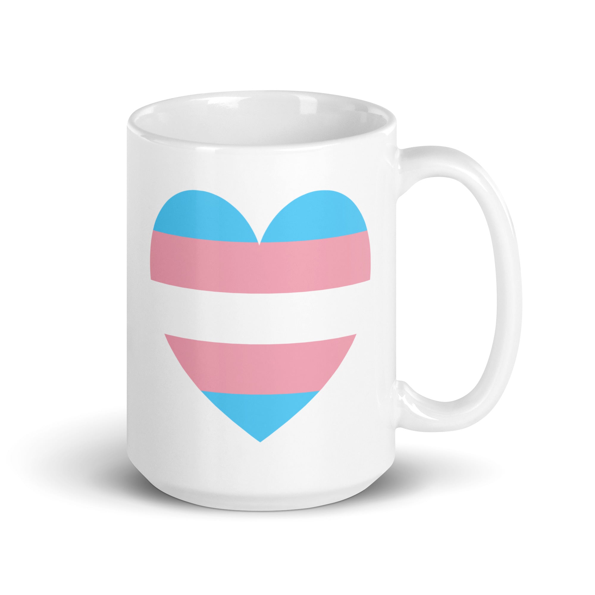 The Trans Heart Mug by Pridelity, part of the Pride Collection 2025, is a white mug featuring a heart design with horizontal stripes in light blue, pink, and white that represent the transgender pride flag.